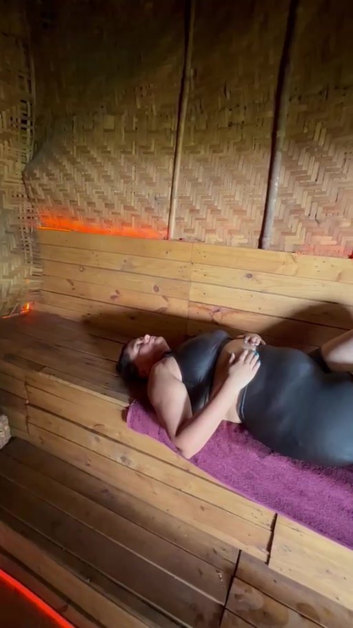 Real guest relaxing inside the Moksha wood-fired sauna in Goa